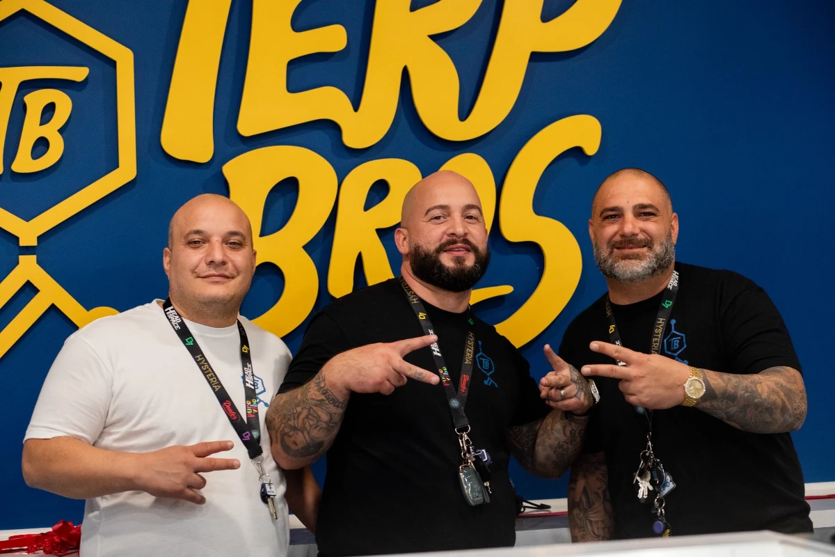 team posing behind counter